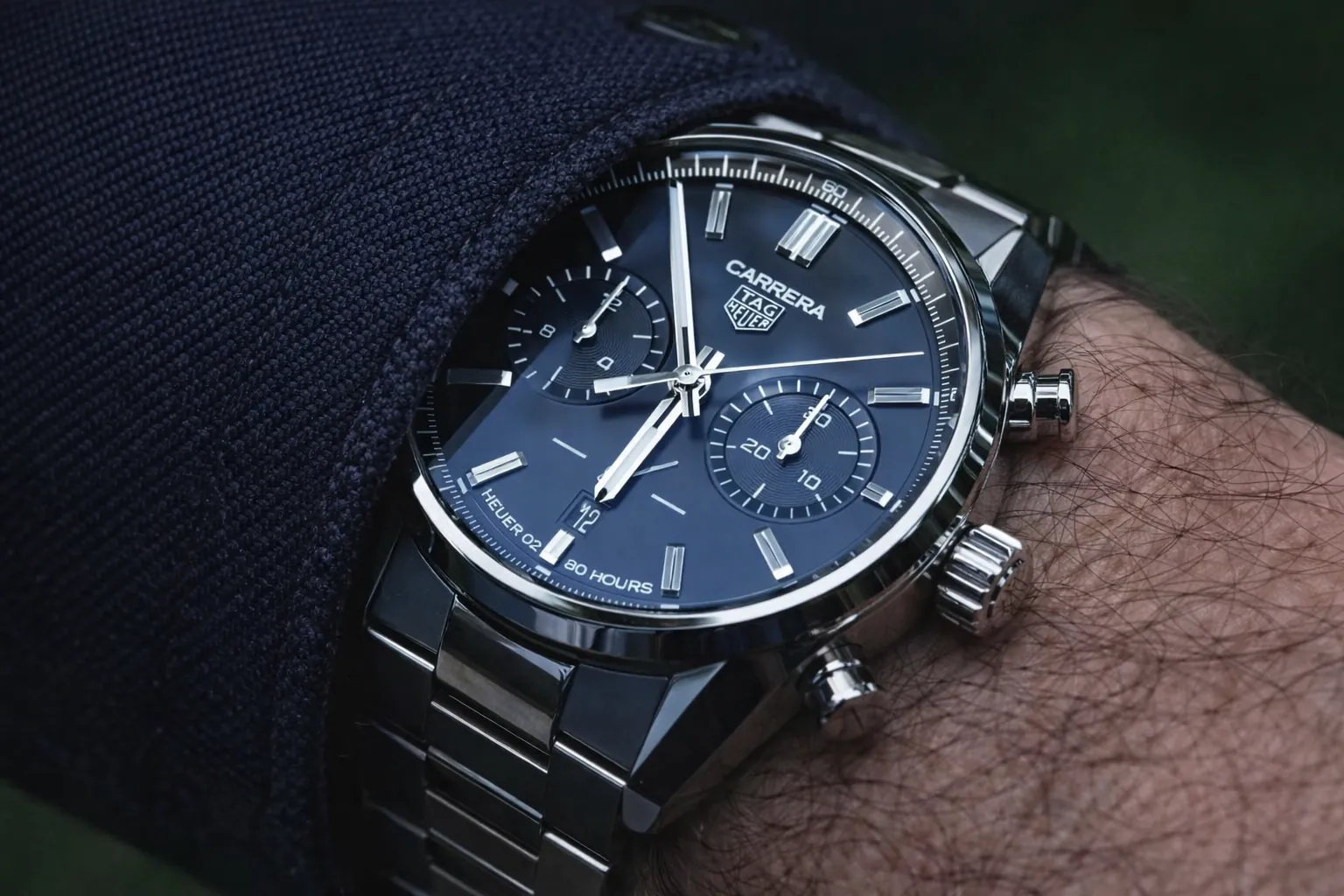 TAG Heuer Carrera blue dial chronograph watch on wrist close up