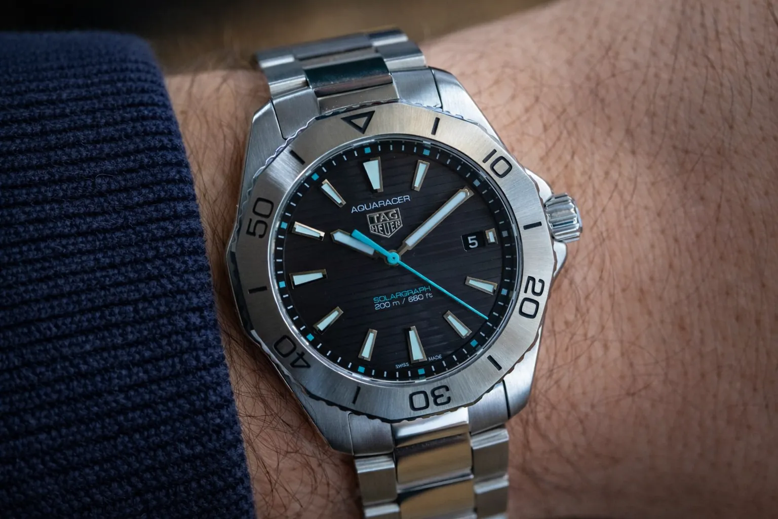 TAG Heuer Aquaracer replica on wrist showing real world wear and finishing detail