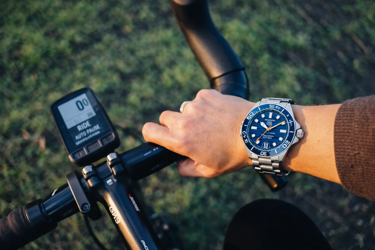 Tag Heuer Aquaracer replica worn in outdoor cycling activity showcasing its durability and sports functionality