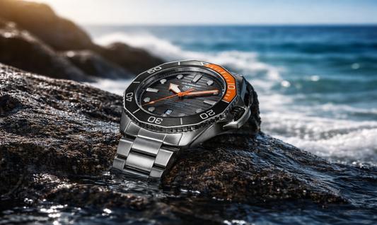 Tag Heuer Aquaracer watch with black dial and orange bezel