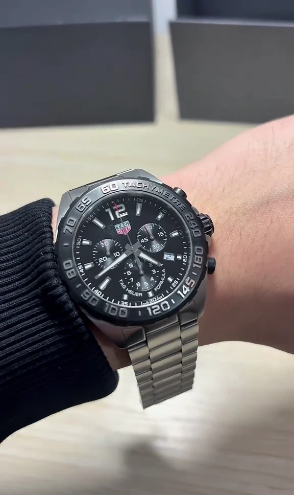 TAG Heuer Formula 1 black chronograph watch on wrist