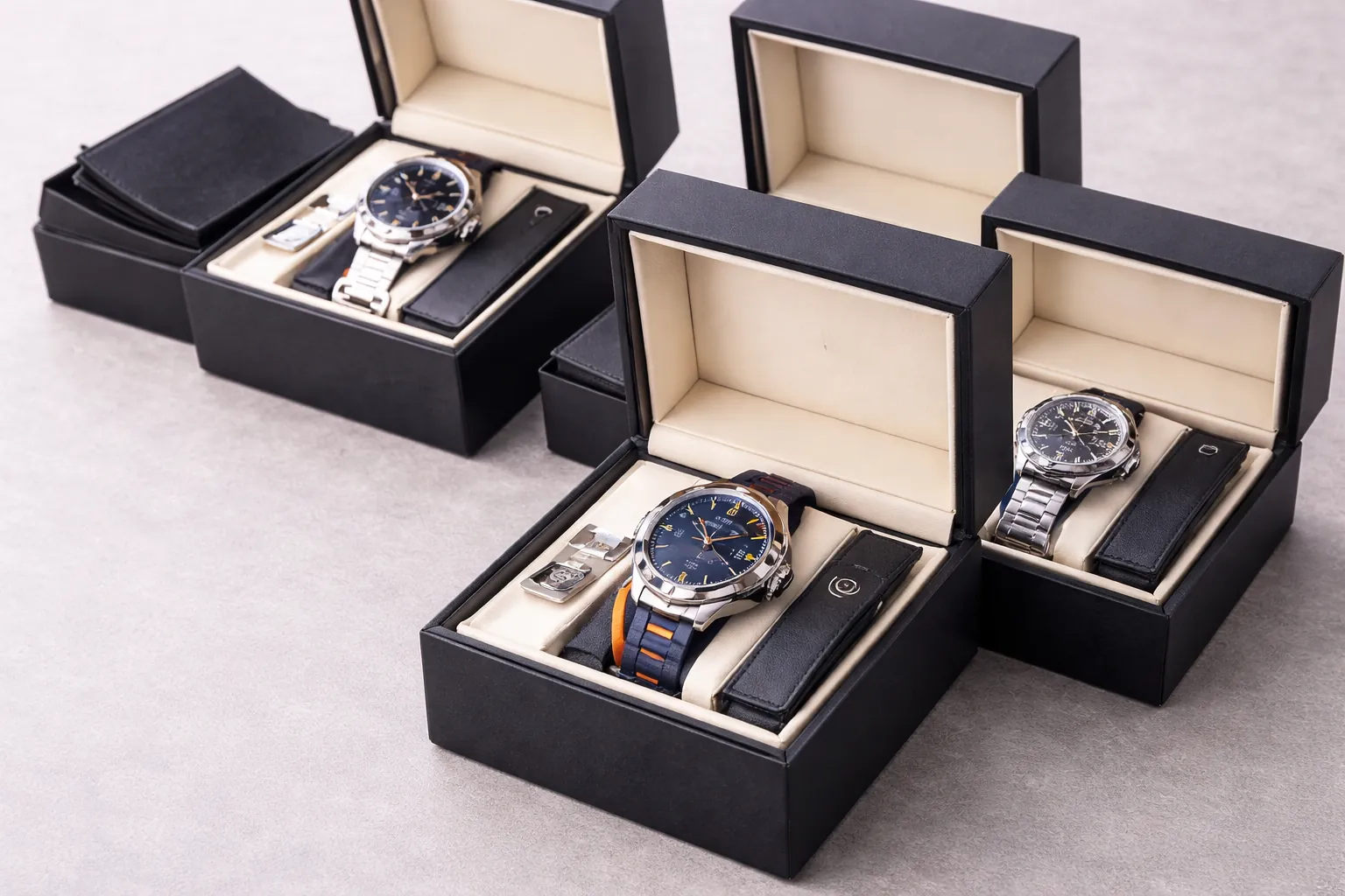 Individual watch packaging showing each wristwatch packed separately with its own box and standard accessories