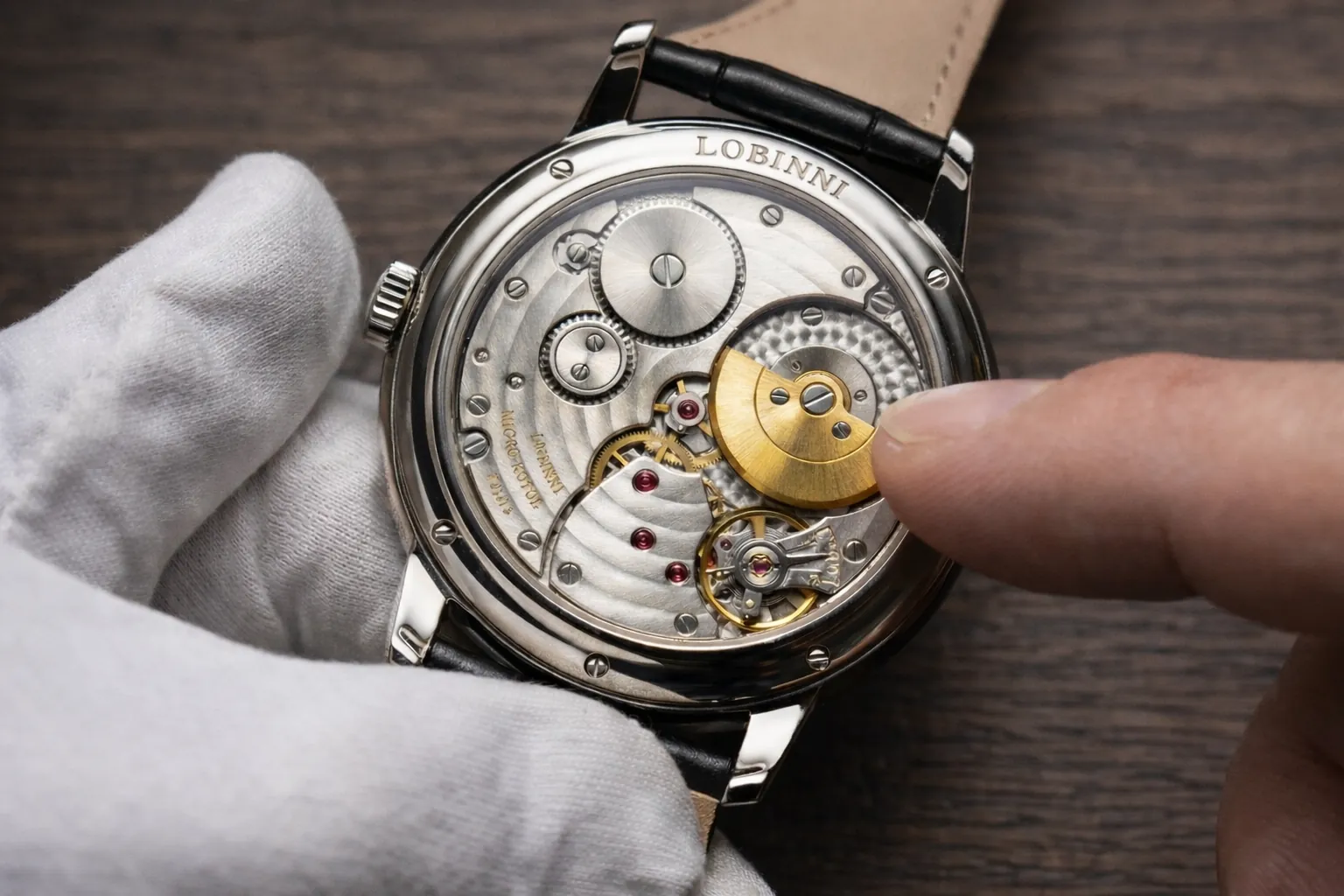 close up of mechanical watch movement showing rotor gears and finishing detail
