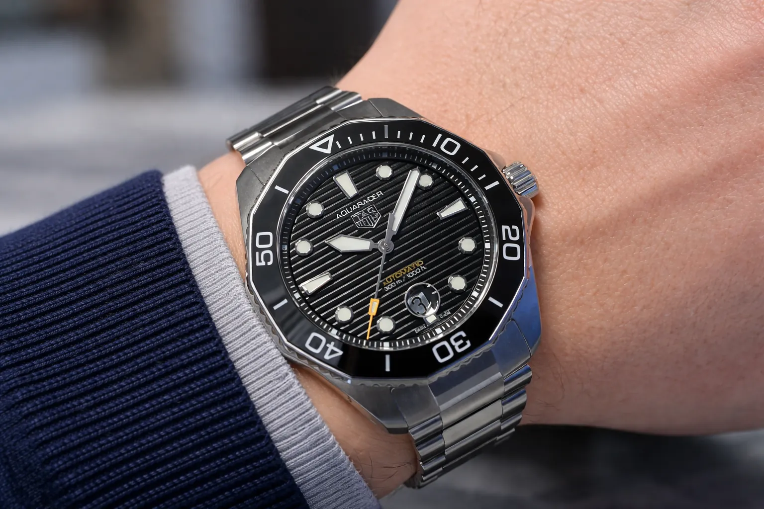 tag heuer aquaracer replica watch on wrist with stainless steel bracelet